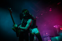 Yves Tumor (right) playing around with guitarist Chris Geratti, covering his eyes with a towel
