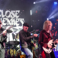 Tom Hamilton, Chasen Hampton and Peter Stroud perform with Close Enemies in Fort Lauderdale, Florida, on January 24, 2026.